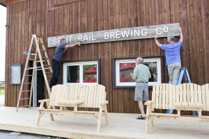 Split Rail hangs its official sign at its Gore Bay brewery.