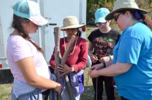 Second Lockerby Guides Tanya Taylor, Jade Bowerman, Sara Vas and Kahlan Kivisto prepare a tripod to safely suspend their food supplies.