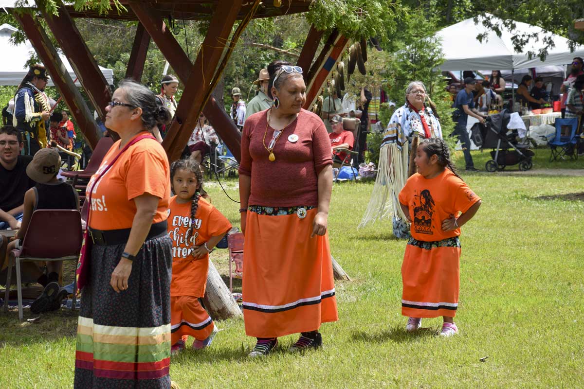 Tabitha Peltier and her daughters were wearing orange to remind everyone that Every Child Matters. photo by Michael Erskine