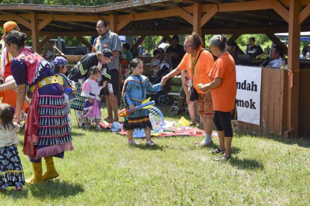 The Tiny Tot giveaway was a popular event for recipients and observers alike. photos by Michael Erskine