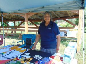 Cultural Support Worker Barb Recollet stands ready to assist in making medicine pouches. photo by Margery Frisch