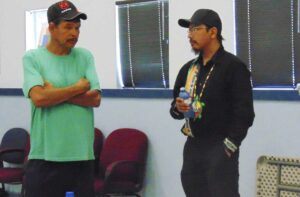 Nathan and Monica’s father, Darren Shawanda, chats with Sheguiandah First Nation Chief Elvis Mishibinijima following the ceremony.