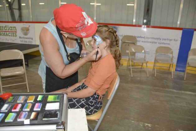 Harper gets a beautiful butterfly during a facepainting session at Summerfest.