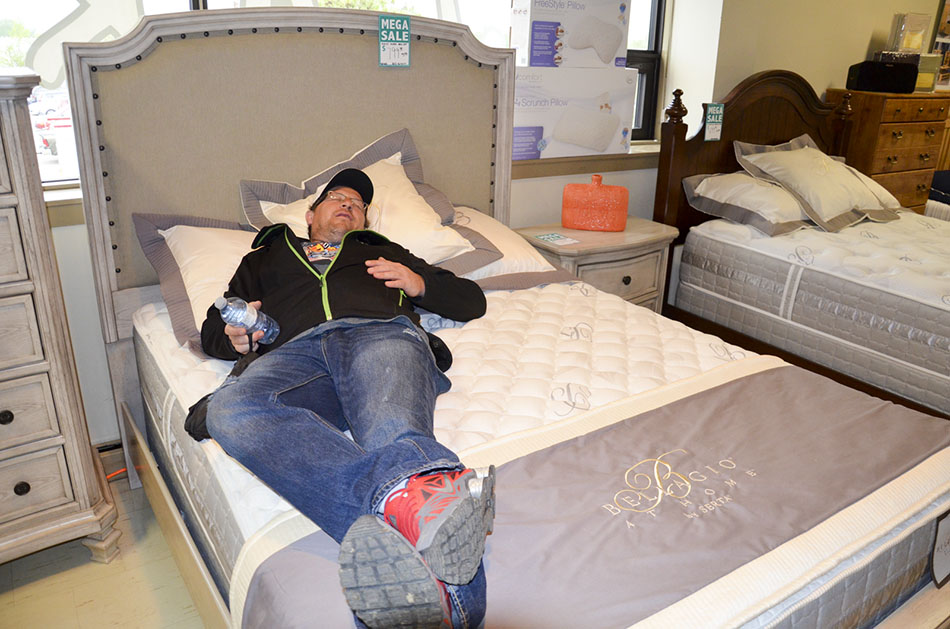 This trade fair ramble can really wear a guy out. This Island shopper took the opportunity to kick back and relax at Jake’s Furniture display in the upstairs hall.