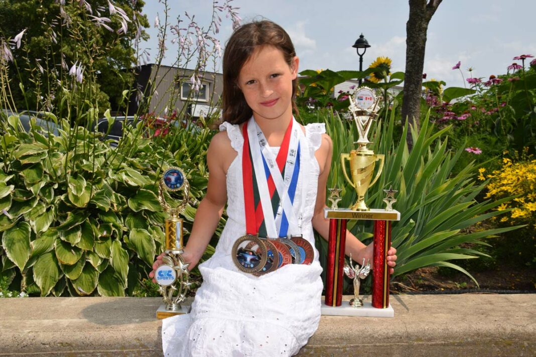 Olivia Cicciarella, 9, is the granddaughter of Ed and Connie Ferguson. Olivia recently competed at a taekwondo international event in South Africa, bringing home a pile of metal ranging from bronze to gold as well as a very impressive trophy. photo by Michael Erskine