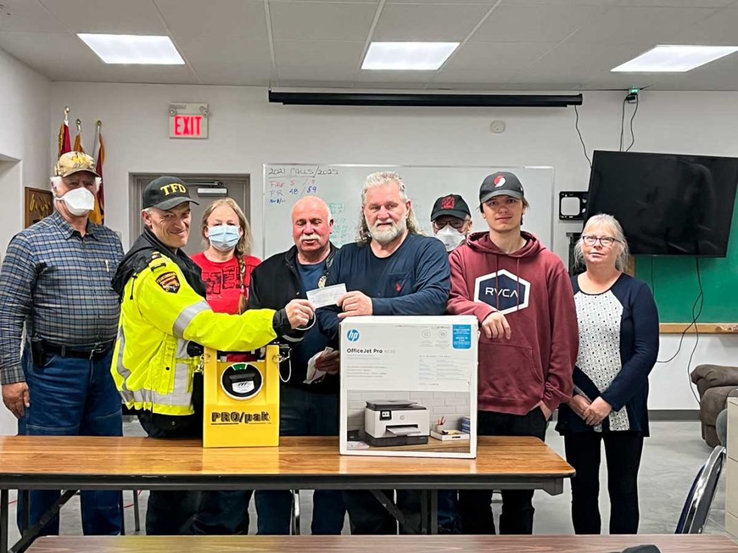 South Shore Volunteer Firefighters Association President Maurice Sagle with a cheque at a recent fire practice.