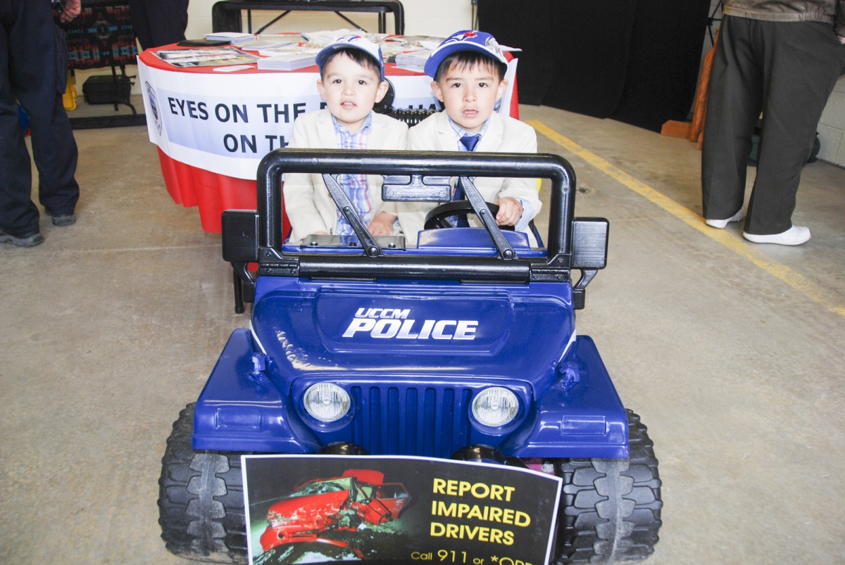 Maximus and James Panamick, officers in the making, try out the UCCM Police Power Wheels Jeep during the station open house on Friday.