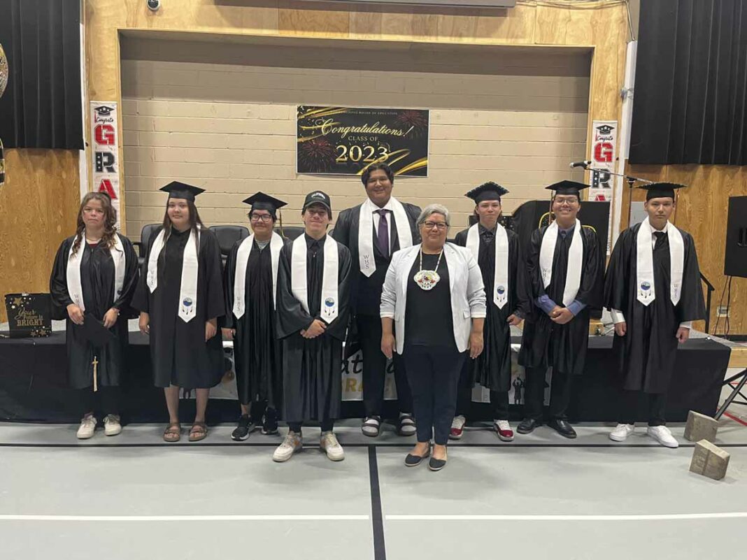 The Wiikwemkoong High School Class of 2023 join Ogimaa Rachel Manitowabi, centre, they include: Jonas Assinewai, Marcus Beaudry, Nicholas Cooper, Sage Eshkawkogan-Recollet, Rianna Eshkawkogan-Shawanda, Stella Flamand, Justina Johnston, Robert Koskie-Obey, Ben Lewis, Sierra Lewis, Aiden Neganegijig-Ballyk, Cadence Pangowish-Peltier, Dorral Recollet and Isadore Trudeau. photos by Alicia McCutcheon