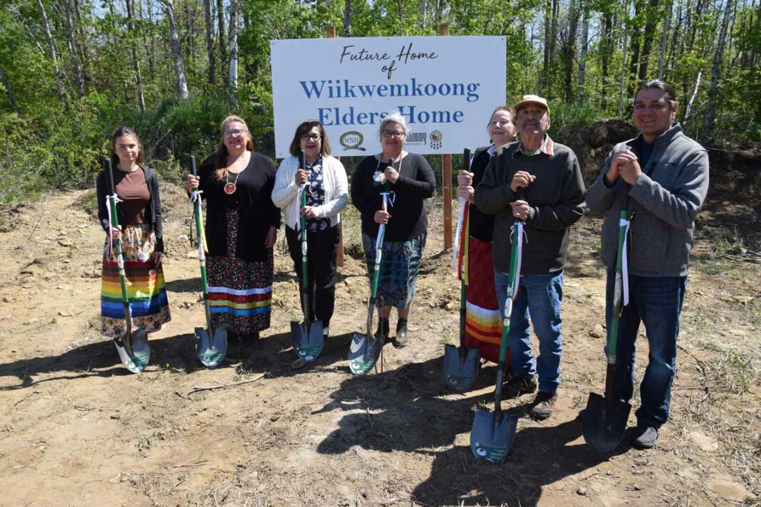 A groundbreaking ceremony for the Wiikwemkoong Elders’ Residence took place last Friday. On hand with shovels in the ground were, from left, Olivia Manitowabi, acting administrator, Elizabeth Cooper, Wiikwemkoong Ogimaa Rachel Manitowabi, Councillor Francis Mandamin, resident representative Jett Francis and former ogimaa and capital fundraising co-chair Duke Peltier. photo by Michael Erskine.