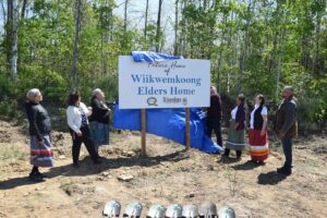 The big reveal. A sign marks the spot of the future home of the Wiikwemkoong Elders’ Home. photo by Michael Erskine.