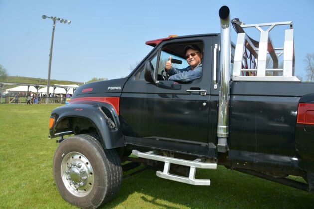 Pat Madahbee gives a big thumbs up as he shows off his ‘Tonka Truck’ at the Sunday car show.