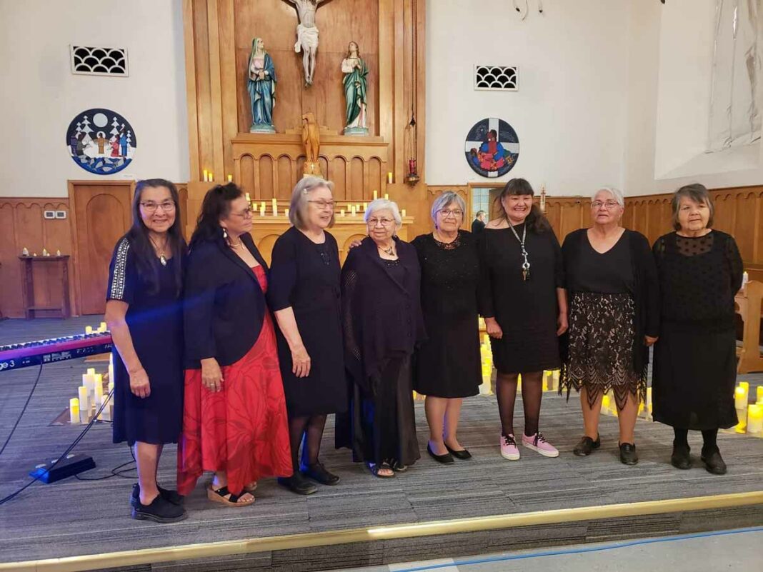 The Wikwemikong Choir, from left, Tish Manitowabi, Audrey Ozawabineshi, Rosemary Pitawankwat, Rosella Kinoshameg, Robin Hill, Eleanoe Abel, Janette George and Marjorie Trudeau, take a bow.