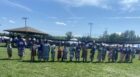 Wiiky-PW-young-Anishinabe-kwe-jingle-dress-dancers-line-up