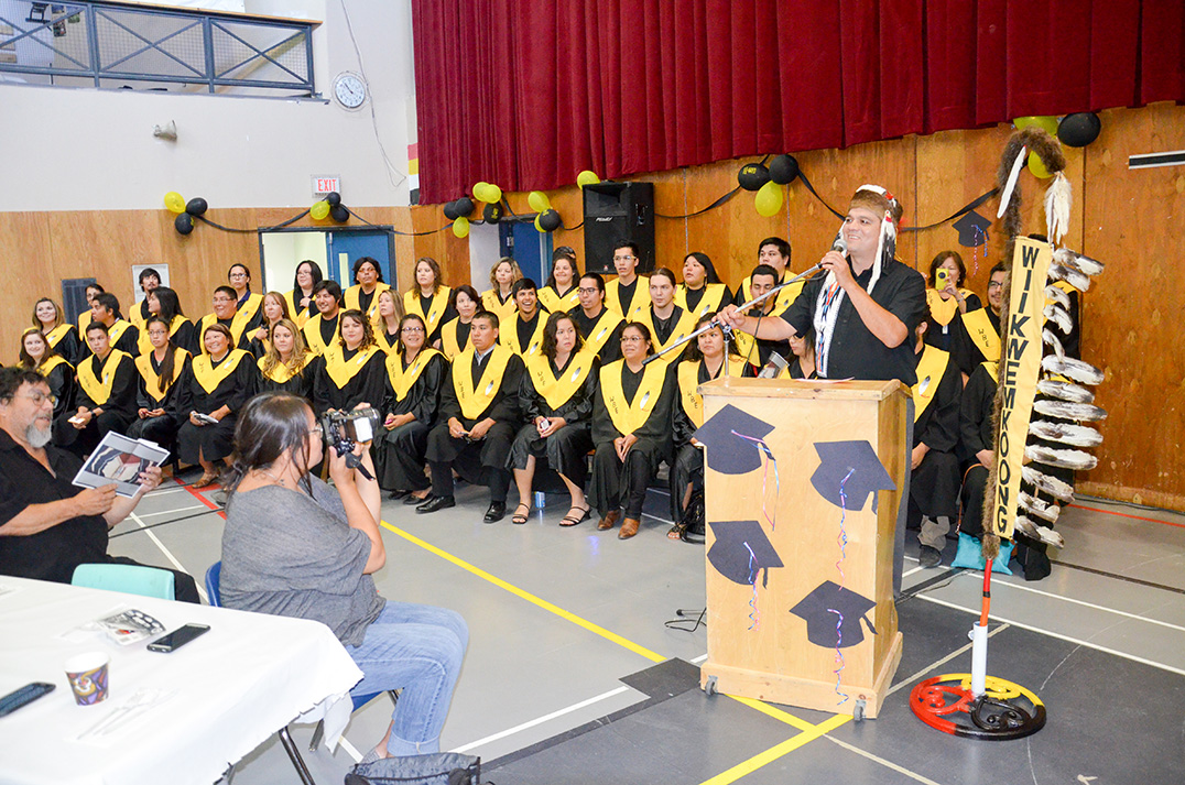 Wikwemikong Chief Duke Peltier gives a welcoming address to the post secondary graduates. photos by Michael Erskine