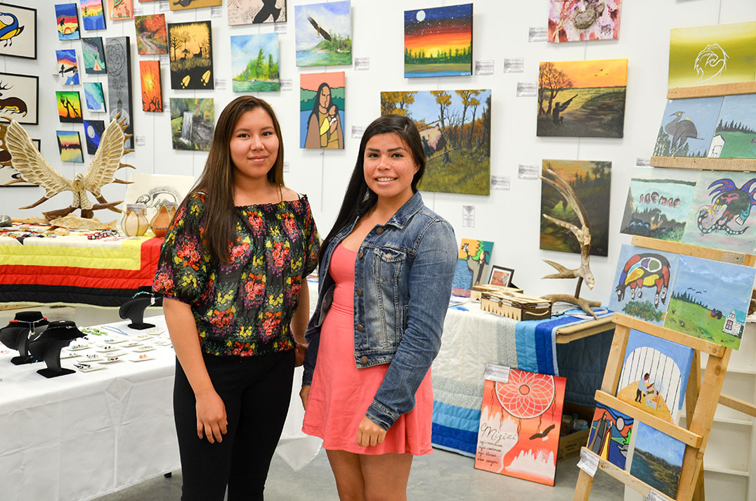 Art gallery summer art students  Evangelista Noakwegijig and Tessa Ominka were ready for the powwow crowds.