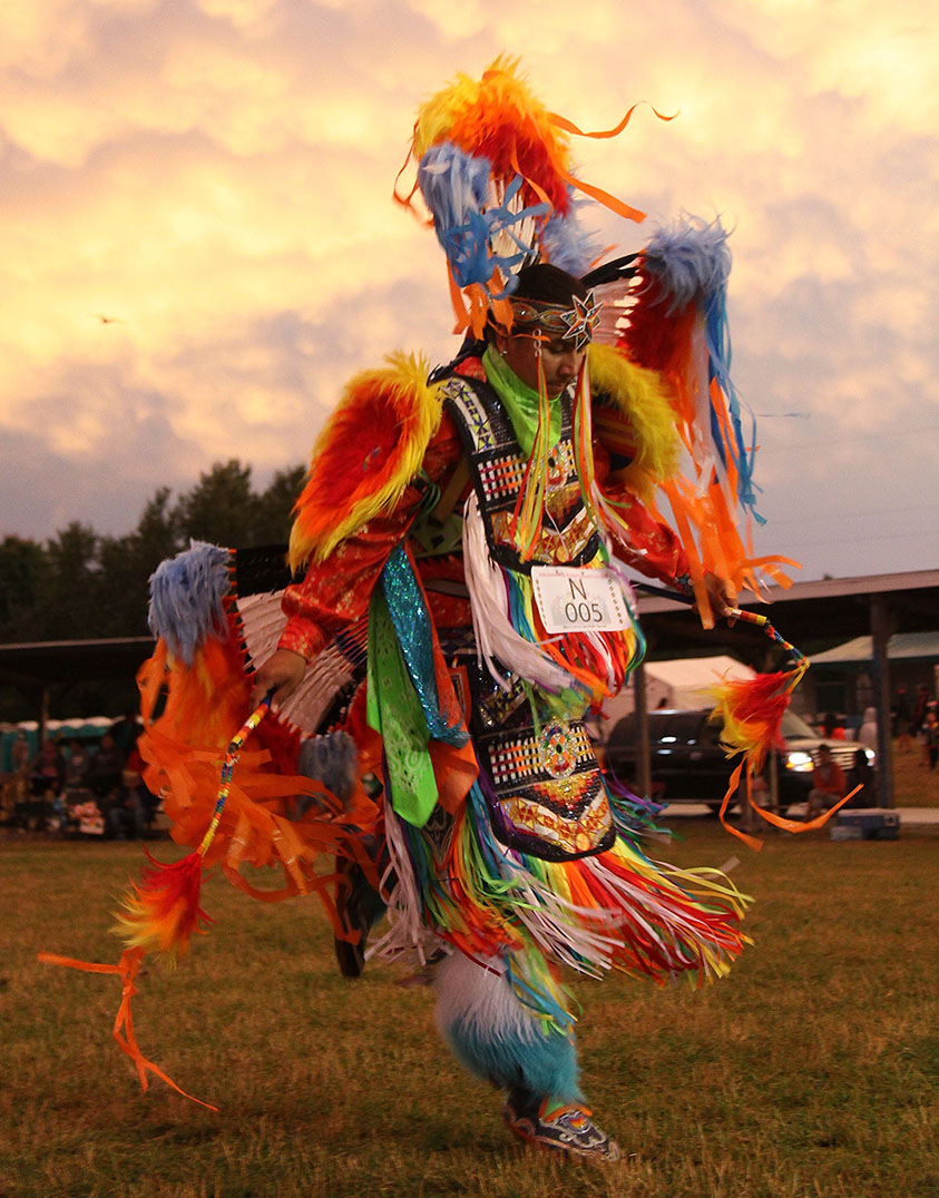 The splendour and pageantry of a competition powwow is exemplified by the colourful regalia of the fancy dancers as they go through their energetic moves in the  arena. photo by Bruno Henry