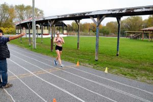 Top female runner Sarah Meilraith crosses the finish line.