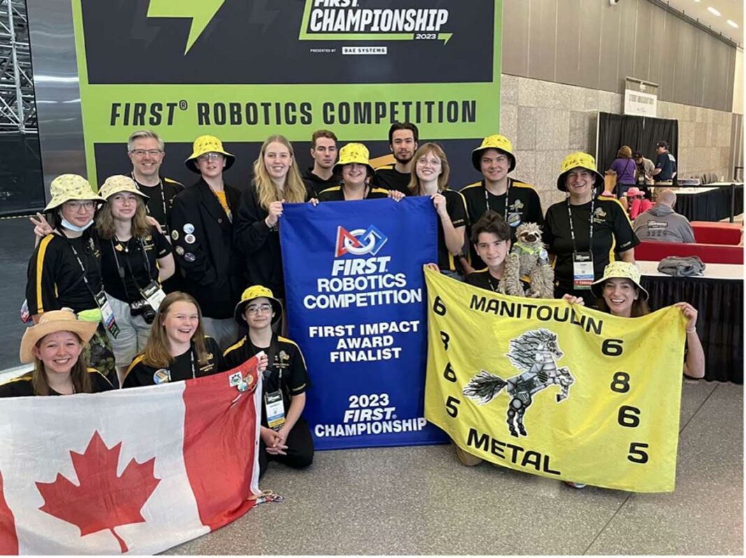 Manitoulin Metal poses for a team photo with their FIRST Impact Award banner.