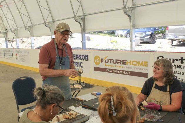 Morris Thompson lead a workshop on how to make a comfort bird wood carving as part of ArtInfusion. photo by Tom Sasvari