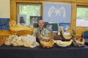 Don Tenniswood, of Silver Water had a display of some of his wood carvings at Art in the Park. photo by Tom Sasvari