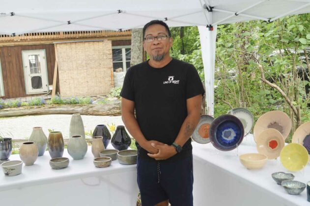 Wayne Malleau of Artisan Works in Kagawong is shown with his pottery. photo by Sharon Jackson