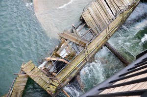 Aerial shots show just how much damage 90 km/hr winds can do. The wooden structure of the cages was smashed by the wave and current action.