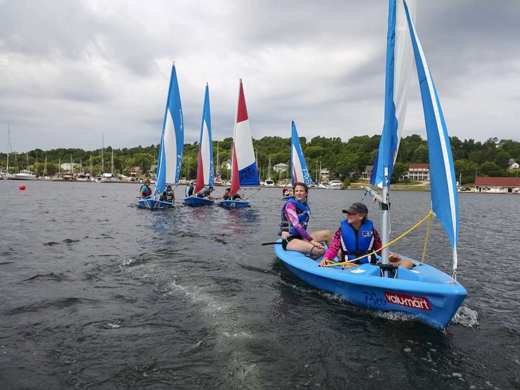 Young sailors set off along Gore Bay’s shore during the Little Current Yacht Club’s Learn to Sail program’s Gore Bay school session in 2019. photo by Bryce Mastelko