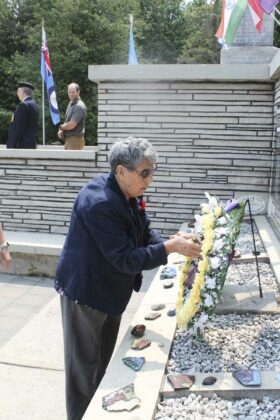 Georgina Cada, the Silver Cross representative, lays a wreath at the Decoration Day service.