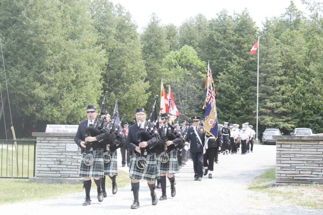 Decoration Day, the first Sunday in June at the Manitoulin District Cenotaph, sees the Sudbury District Pipe Band attend the ceremonies as they have done every year since at least the 1930s. The march was on led by Parade Marshall Comrade Ron Steeves. photo by Tom Sasvari.