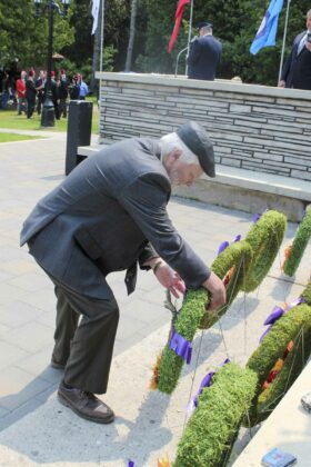 Mayor Richard Stephens lays a wreath on behalf of the  Municipality of Central Manitoulin.