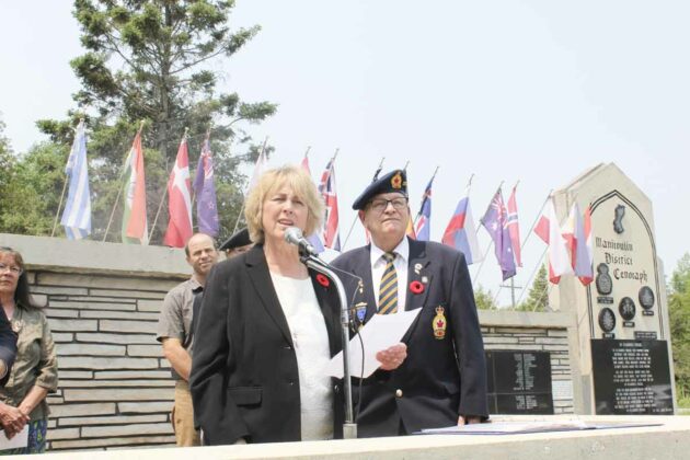 Algoma-Manitoulin-Kapskasing MP Carol Hughes paid tribute those who served their country while speaking at the Decoration Day service. Master of cermonies Comrade Jim Wood is in the backgound.