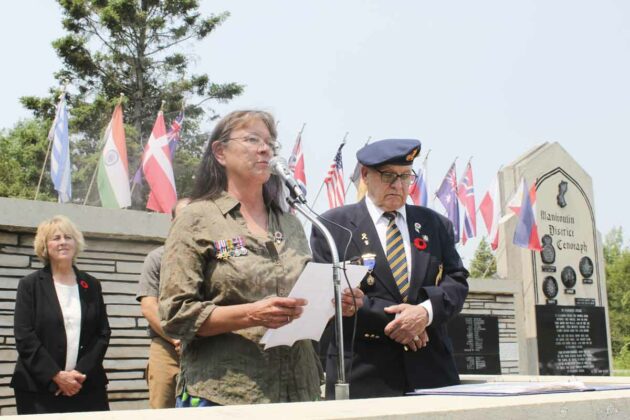 Audrey Stone, assistant to AOK Chief Patsy Corbiere, speaks on behalf on behalf of Indigenous people of Manitoulin at Decoration Day.