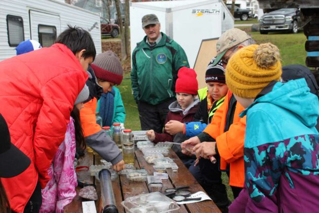 Bill Strain of the Little Current Fish and Game Club took the students on a tour of the bell jar hatchery and fossils on display as part of the tour.