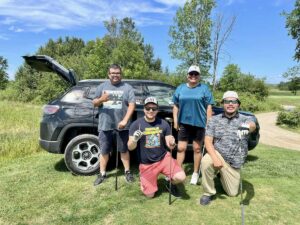 A mixed division team who participated in the first annual Chip in Fore Kids charity golf tournament put on by Kina Gbezhgomi Child and Family Services at Rainbow Ridge Golf Course on July 22.