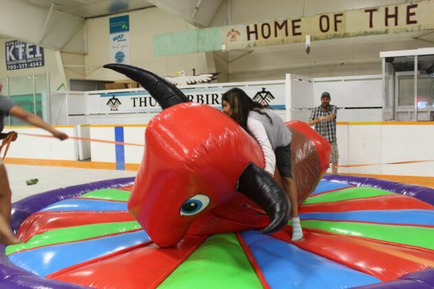 Youngsters of all ages took turns riding the bronco, one of the many games held as part of Fun Days weekend in M’Chigeeng.