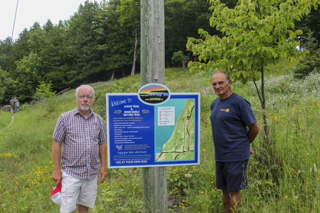 The Town of Gore Bay has opened a new hiking trail with its partners in the project, the Gore Bay Rotary Club and the Douglas A. Smith family. From left is Gore Bay Mayor Ron Lane and Rotary Club president Jack Clark at the start of the one kilometre trail, off East Street in town.