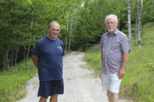 From left in photo, Jack Clark president of the Gore Bay Rotary Club and Gore Bay Mayor Ron Lane stand at the start of the new Lodge Trail off East Street, in town.