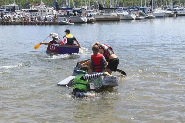 Some of the boats had a difficult time staying on, instead of in the water at the Cardboard boat regatta races.