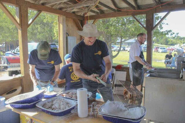 Members of the Gore Bay Rotary Club prepare the food for their fish fry dinner.