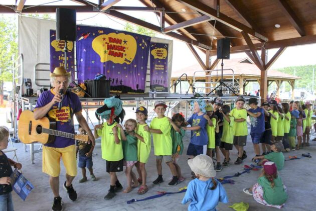 Dan the Music Man and a youngster led the ‘Alligator Parade.