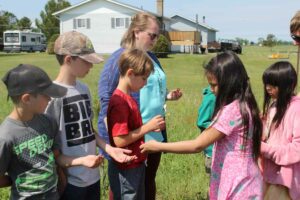 Lakeview School Grade 2 students present gifts to the Grade 2/3 class students from C.C. McLean.