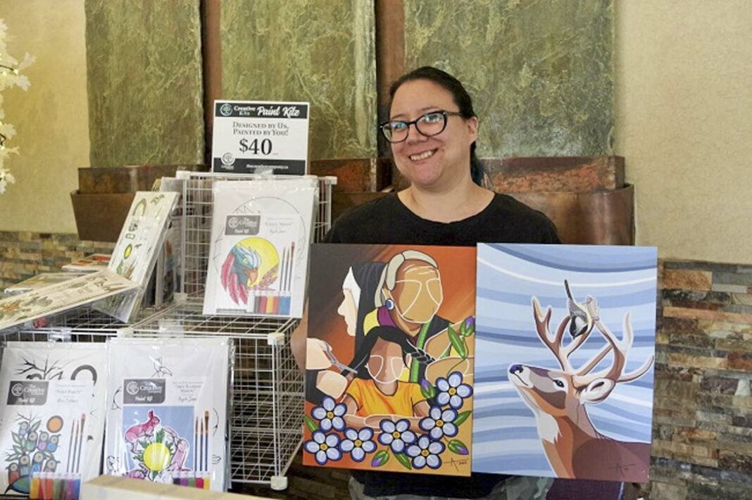 Artist Angela Jason, of Sheshegwaning First Nation who now lives in Thunder Bay, displays two of her digital art designs at The Creative Company.