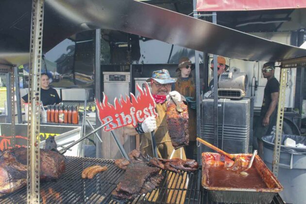 Ribber Jorge Gonzalez of Go Gonzalez BBQ displays a rack of their delicious ribs and a trophy the team won recently at a ribfest held in London, Ontario.