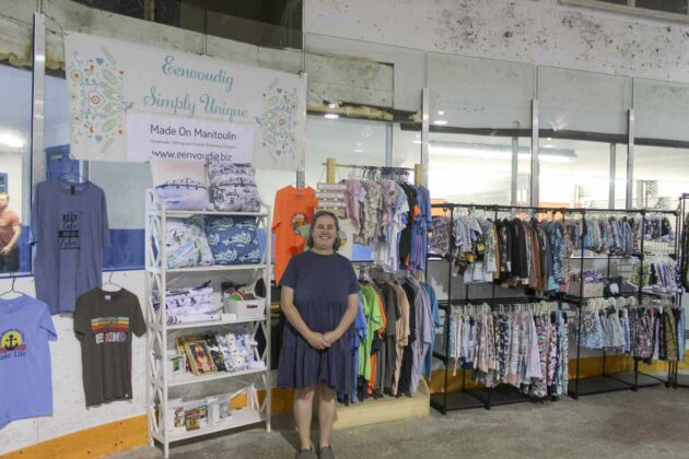 Delray McCarthy of Eenvoudig A Simply Unique Boutique displays some of the handmade clothing and sublimated designs she had at her booth at the Central Manitoulin Market.