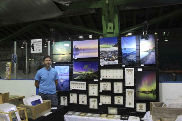 Visual artist Jeff Dixon displays some of his works at the Central Manitoulin market, held as part of the Central Manitoulin Lions Club Homecoming Weekend celebrations.