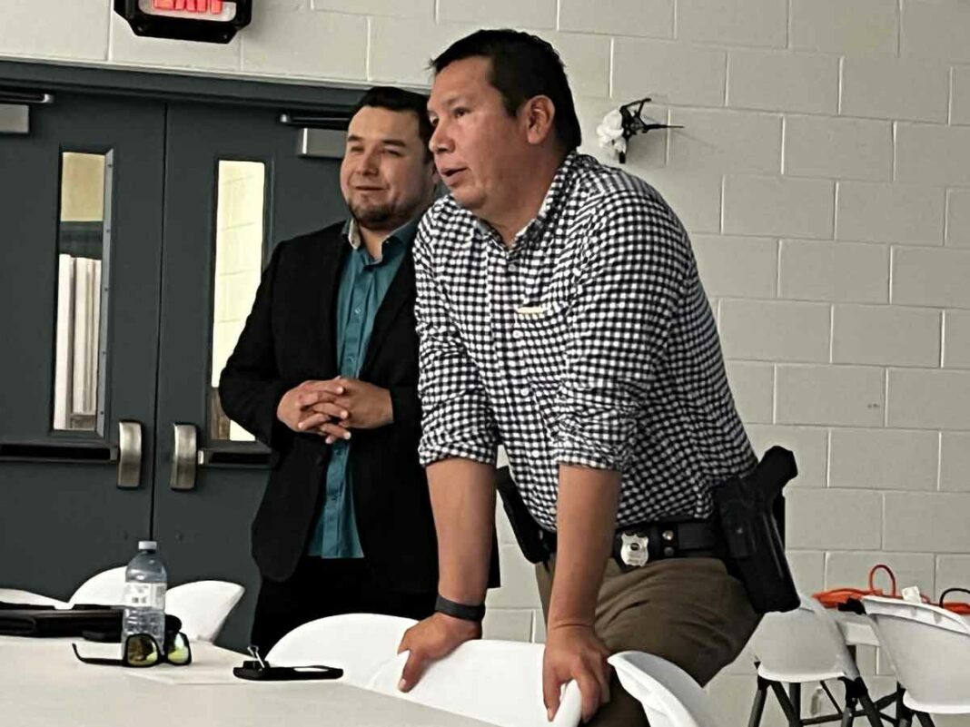 Detective Sergeant Todd Fox, left, and Detective Constable Ed Simon with UCCM Anishinaabe Police discuss human trafficking knowledge gaps. photo by Lori Thompson