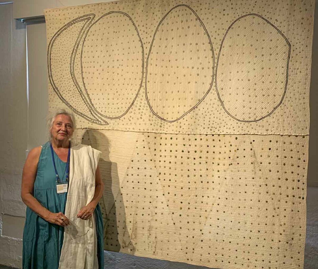 Sheguiandah quilter Judy Martin is shown with her award-winning quilt ‘Under Drifting Stars.’