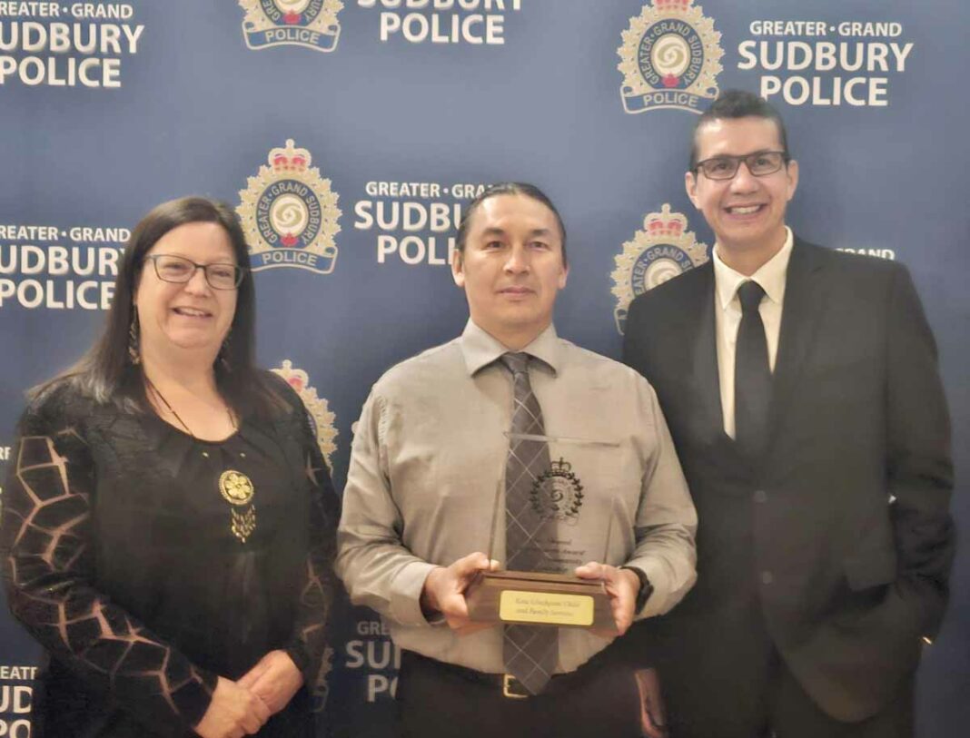 Kina Gbezhgomi Child and Family Services (KGCFS) received a Community Partnership Award from the Greater Sudbury Police Service (GSPS). In photo, left to right, is Denise Morrow executive director of KGCFS, Lyle Peltier KGCFS family team gathering coordinator, Constable Darryl Rivers GSPS Indigenous liaison officer.