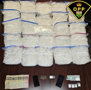 Police seized approximately 25 kilograms of suspected methamphetamine, 15.2 grams of suspected cocaine, $3,400 in Canadian currency, a weight scale, 39-millimetre rounds of ammunition, packaging materials and two cell phones.