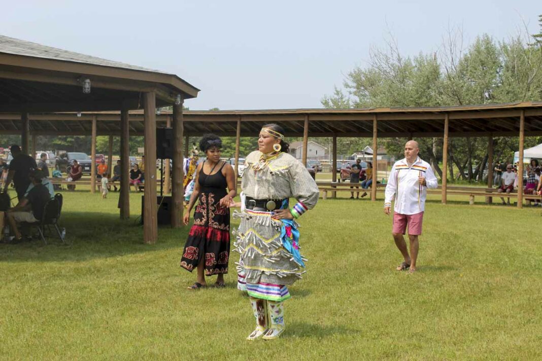 Shannon Manitowabi, right, was the head female dancer at the powwow. photo by Tom Sasvari